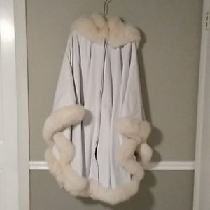 Coat, glamorous, leather with Fox trim.